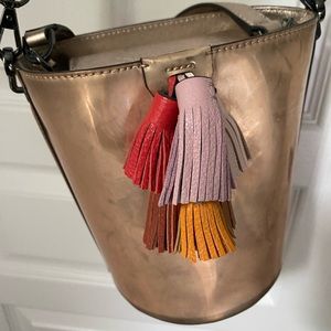 Rebecca Minkoff metallic bucket bag with tassels